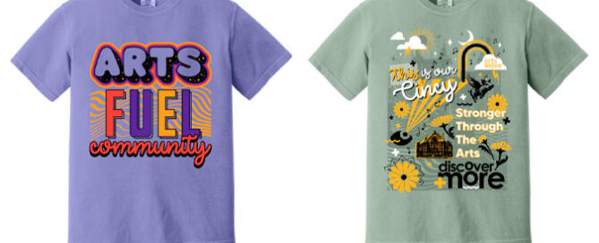 Two colorful T-shirts promoting Cincinnati's arts community, featuring vibrant designs and messages about supporting local arts and expressing love for Cincinnati's cultural scene.