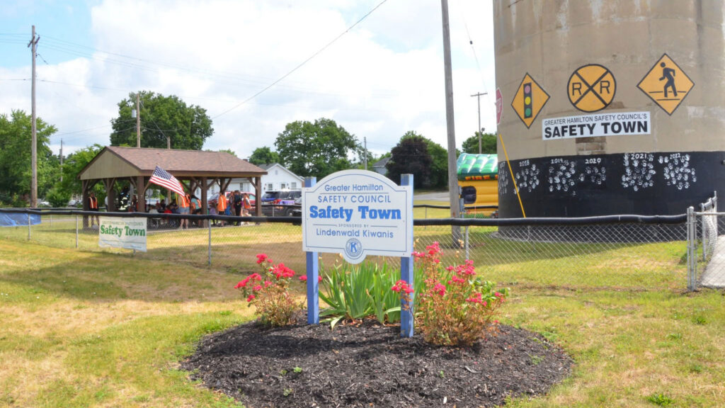 A sign for Greater Hamilton's Safety Town in front of a pavilion hosting the event