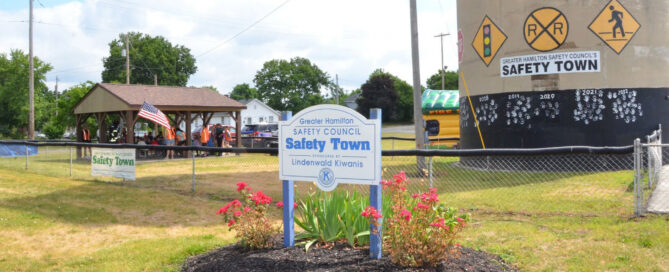 A sign for Greater Hamilton's Safety Town in front of a pavilion hosting the event